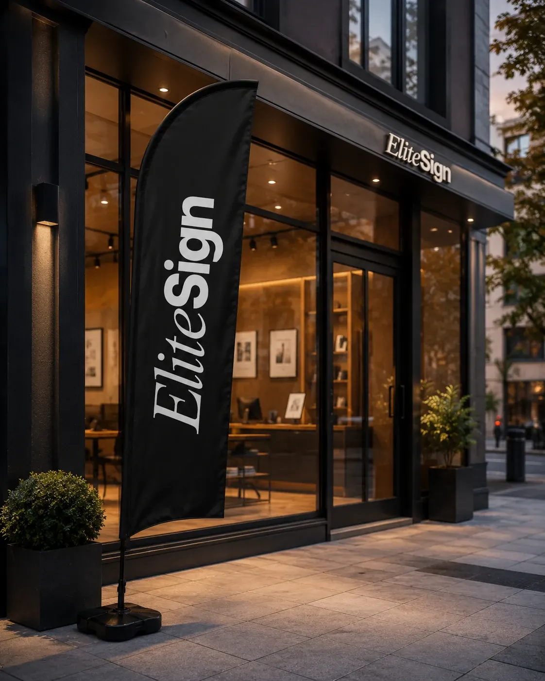 Sort Elite Sign bannerflag foran en mørk butiksfacade